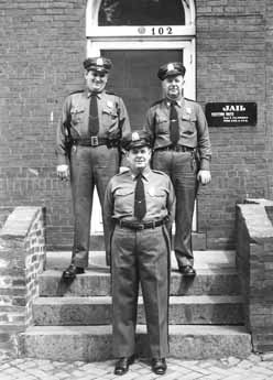 Sheriff Roger Powell and deputies outside the current Adult Detention Center, built in 1958